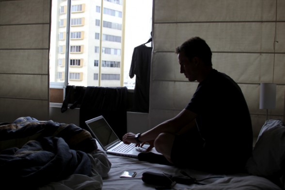 darren alff in his apartment using his computer