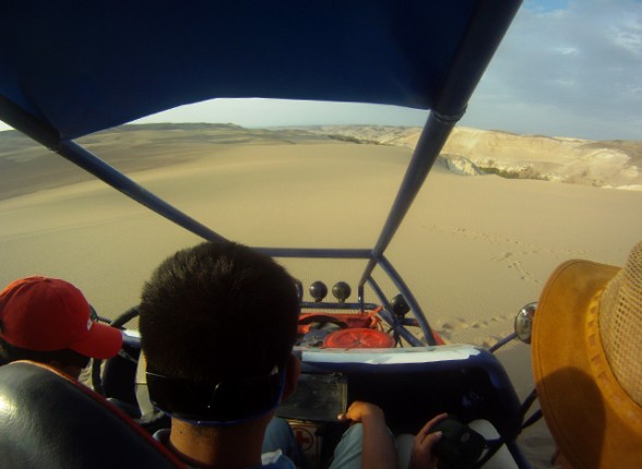dune buggy on sand dunes near nazca peru