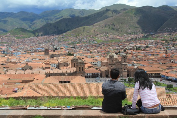young teenagers looking down on the city of cuzco peru