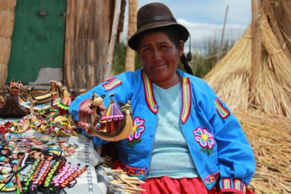 puno peru floating island woman selling crafts