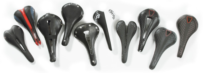 an assortent of bicycle saddles and seats