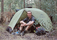 Darren Alff camping with his bike in South Africa