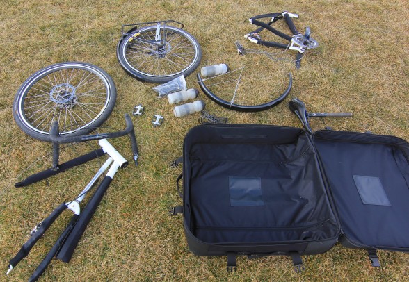 unpacked and unfolded Co-Motion Pangea touring bicycle and Co-Pilot travel case