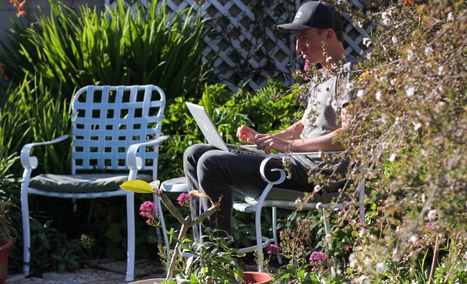 Darren Alff working in flower garden