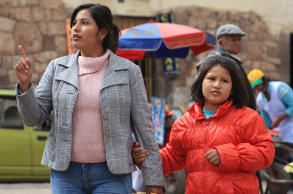 mom and daughter walking in cusco peru