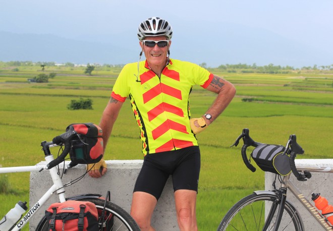 Kevin Burrett poses for a photo during his bicycle tour in taiwan