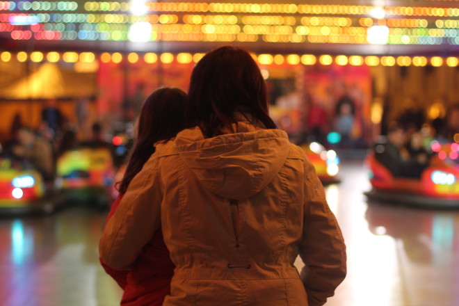 mother and daughter sharing a special moment at the bumper cars