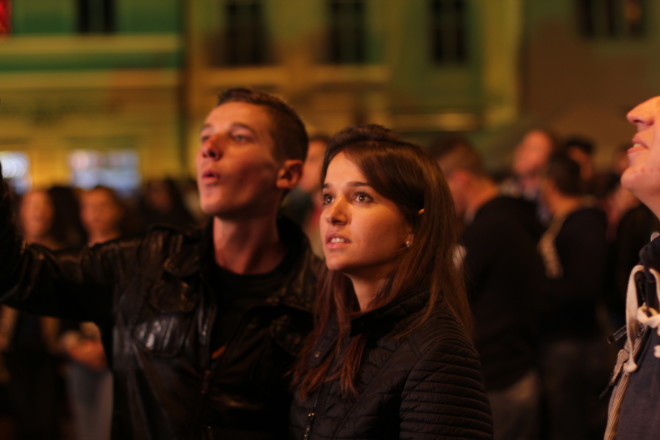young teenagers looking up over crowd