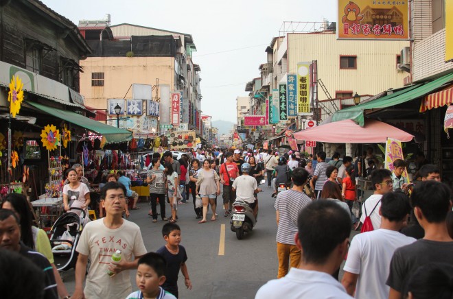 people walking the main pedestrian street in qishan, taiwan