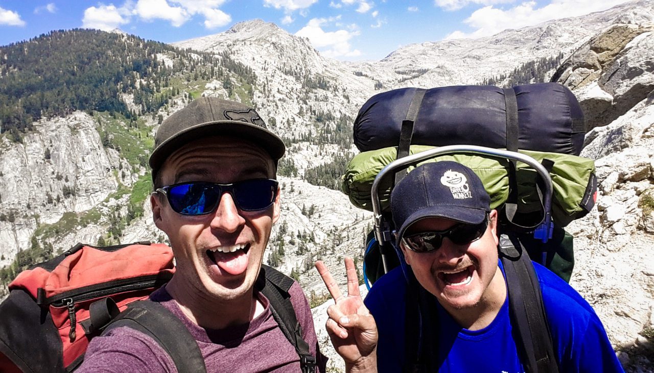 Two happy backpacker men having fun in the mountains of Sequoia National Park