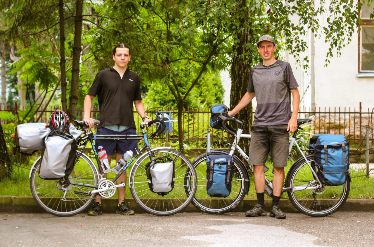 Two young men with touring bicycles