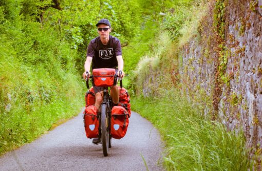 darren alff on a fully-loaded touring bicycle in oviedo spain