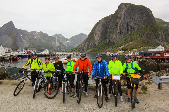 Lofoten Islands bicycle tour - group of friends enjoy cycling in Norway