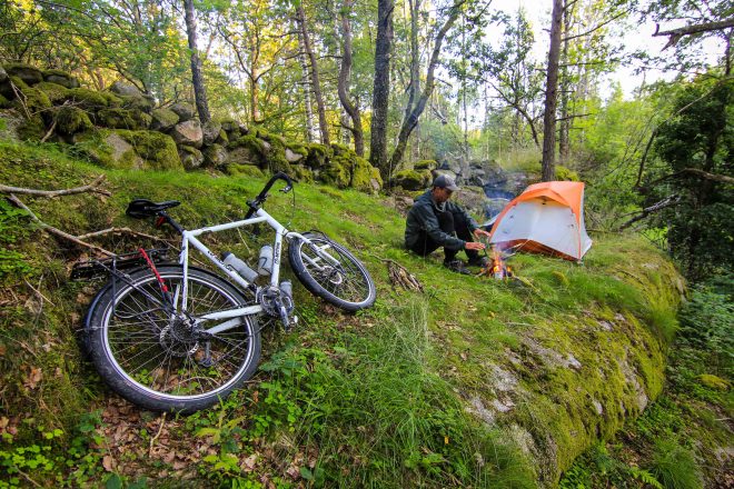Sweden bike tour with tent and campfire