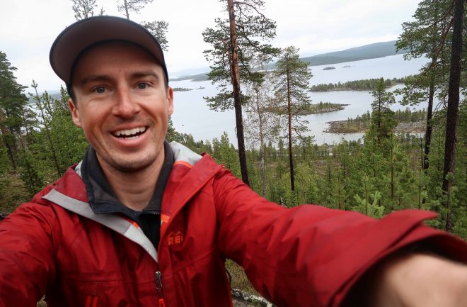Darren Alff smiling lake selfie in Finland