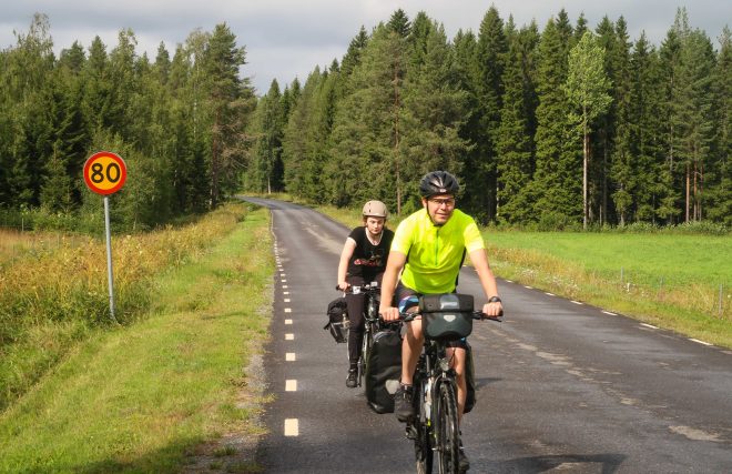 Doug Ireland and Line Gammelli riding bikes in northern Sweden