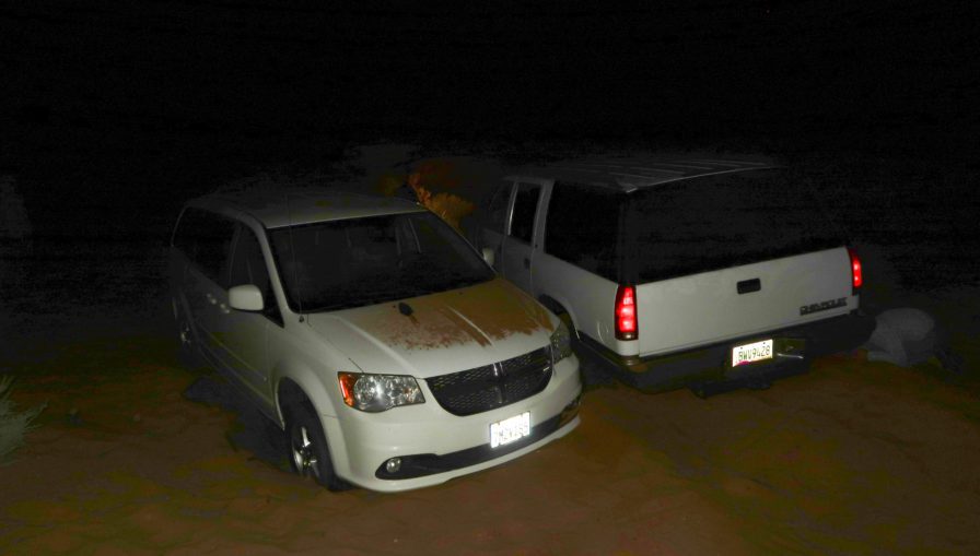 two vehicles stuck in deep sand