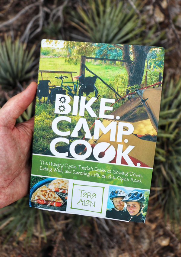 Bike Camp Cookbook held in hand