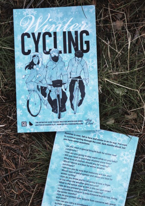 Winter Cycling - front and back book cover laying in grass
