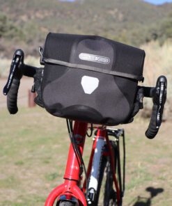 Black/Gray Ortlieb Ultimate 6 Plus 7 Liter Handlebar Bag on touring bicycle with drop bars