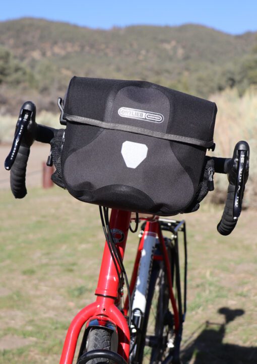 Black/Gray Ortlieb Ultimate 6 Plus 7 Liter Handlebar Bag on touring bicycle with drop bars